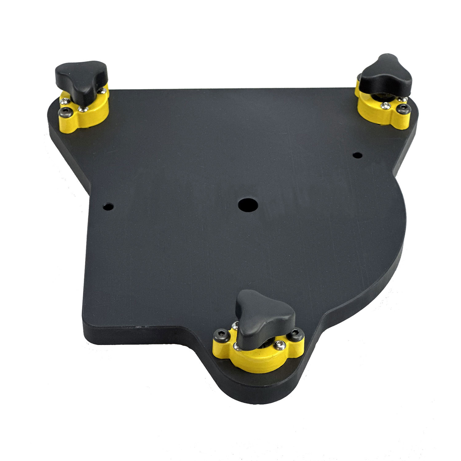 A black triangular mounting plate with three yellow and black magnetic locks, a center hole for mounting to a platform, and two holes for attaching a MicroScribe portable arm.