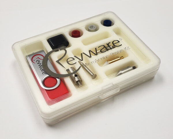 A small clear box on white background with the lid closed, the Revware logo on the lid, and a white foam insert showing MicroScribe probe tips and USB drive.
