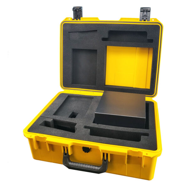 An open yellow carry case with a black handle, displaying dark gray foam and a small accessory box.