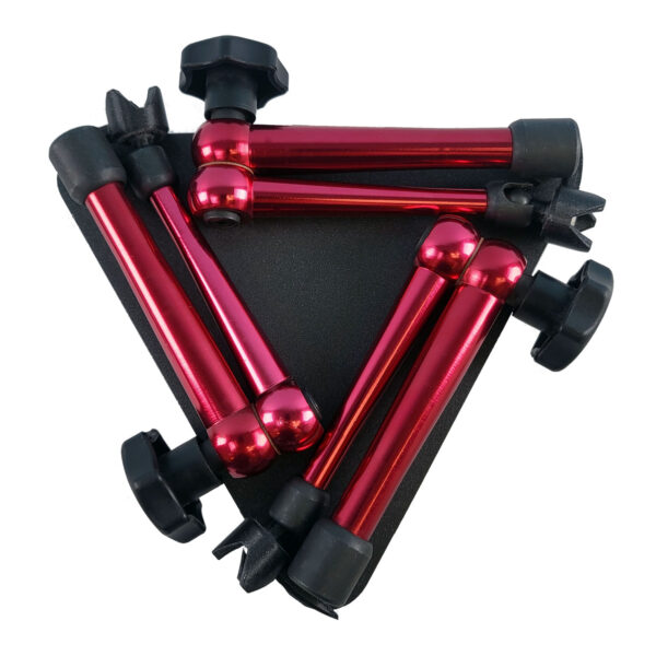 A three-armed specimen stand folded flat for compact storage. The stand has a black triangular base and three red metal arms with black pointed tips.